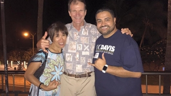 Three people smiling 