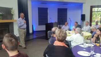 Man talking in front of audience 