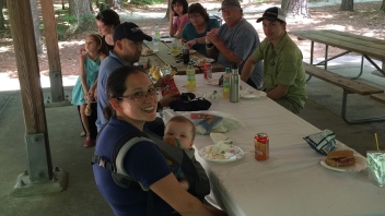 People sitting at outdoor table 