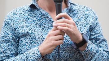 Man talking into microphone 