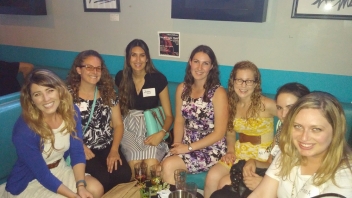 Group of Aggies sitting at a booth 