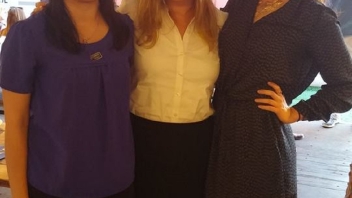 Three women smiling together 