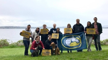 UC Davis Alumni in Seattle with water behind them