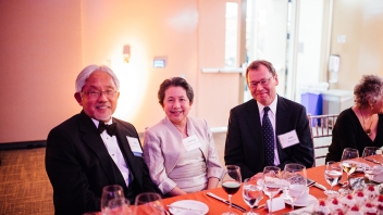 Three people in Betty Irene Moore Hall smiling at camera