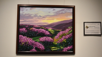 A watercolor painting of a field of purple flowers.