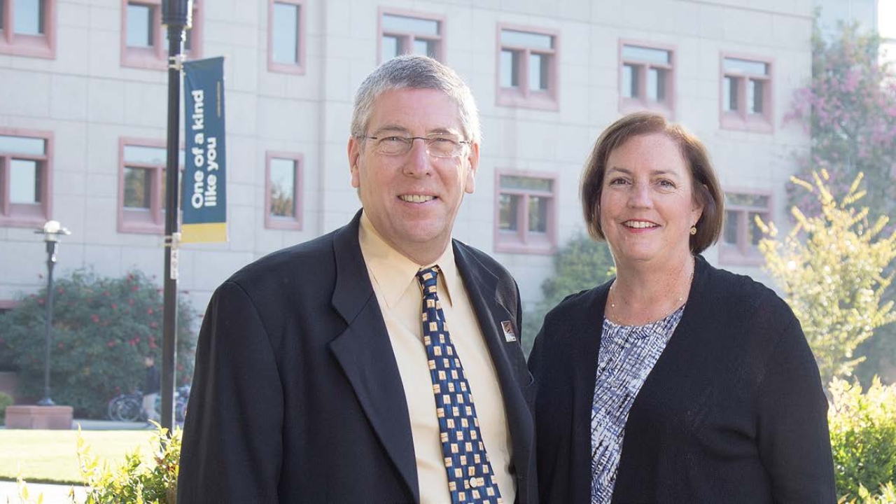 Deborah Neff stands with College of Biological Sciences Dean Mark Winey