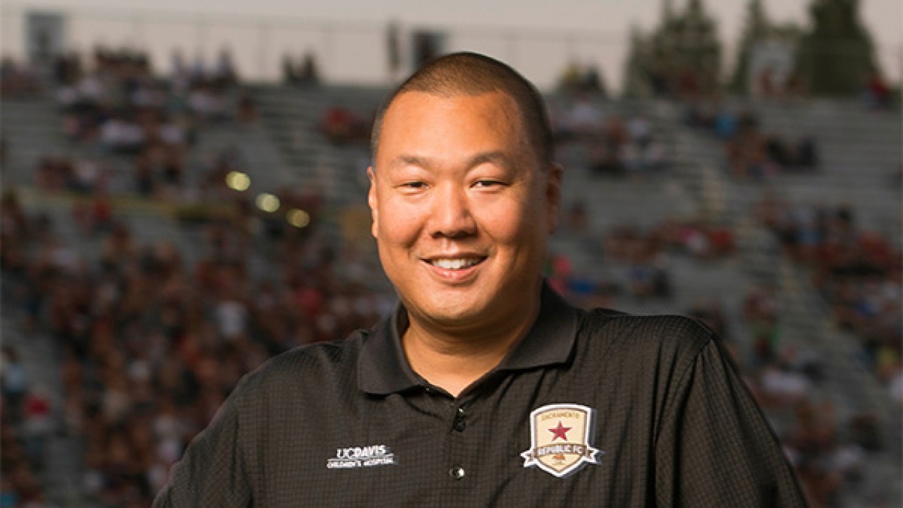 Brent Sasaki holding soccer ball