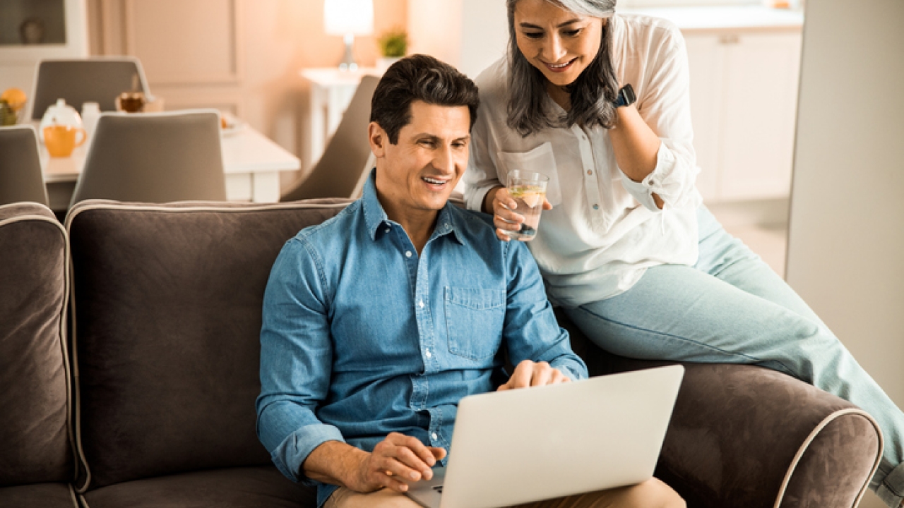 two people looking at a computer