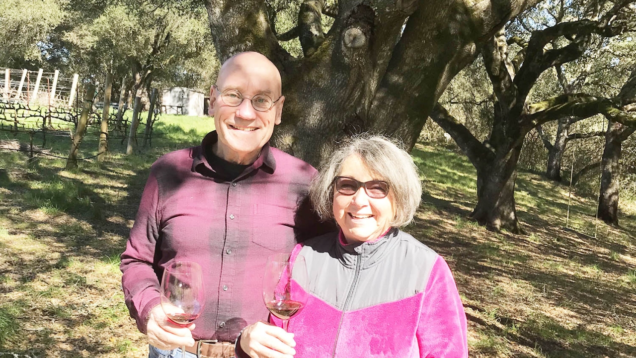 Russell and Bette Russel standing in their vineyard