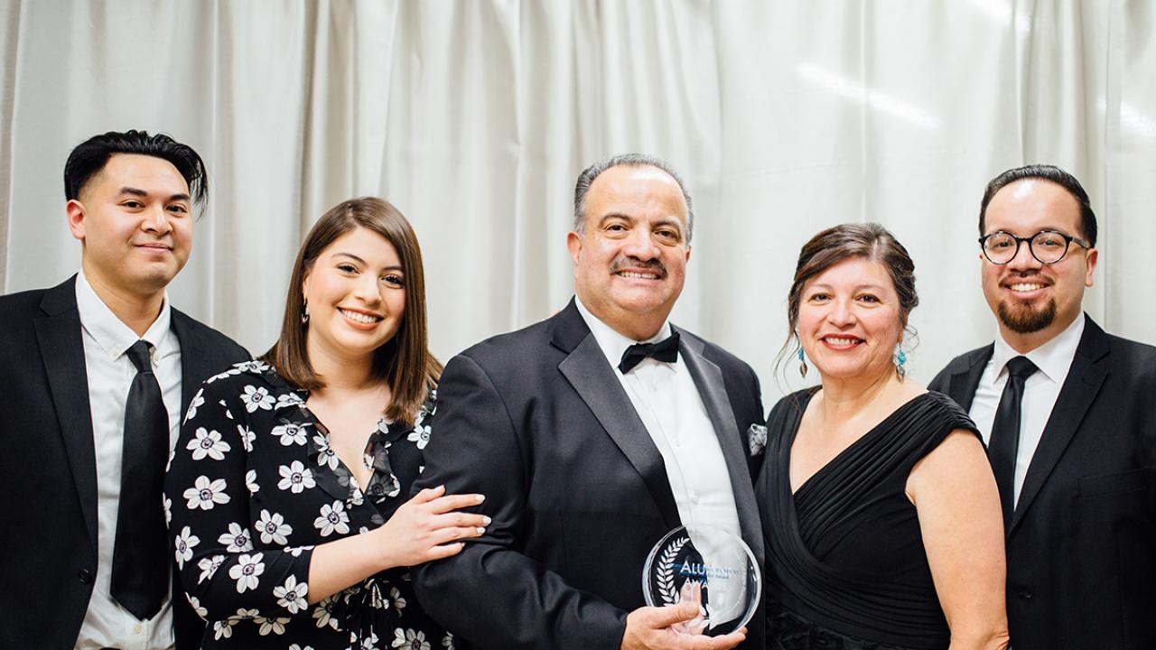 UC Davis Alumni Award honoree Francisco Rodriguez poses with family at Betty Irene Moore Hall School of Nursing