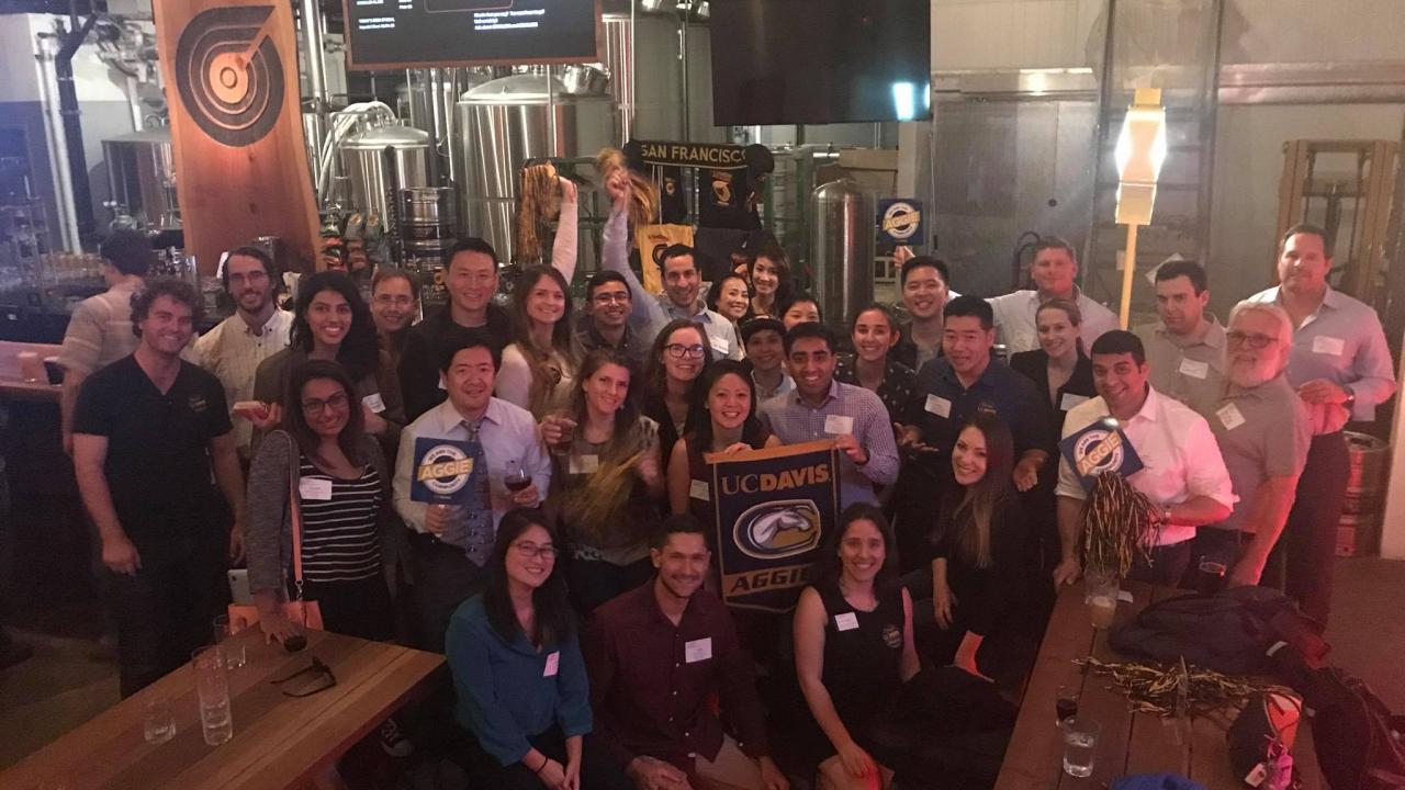Group of alumni and friends at a 2018 Happy Hour