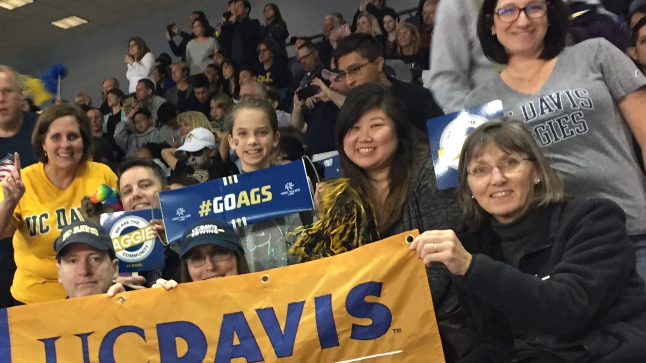 Group of alumni and friends at a 2018 basketball game