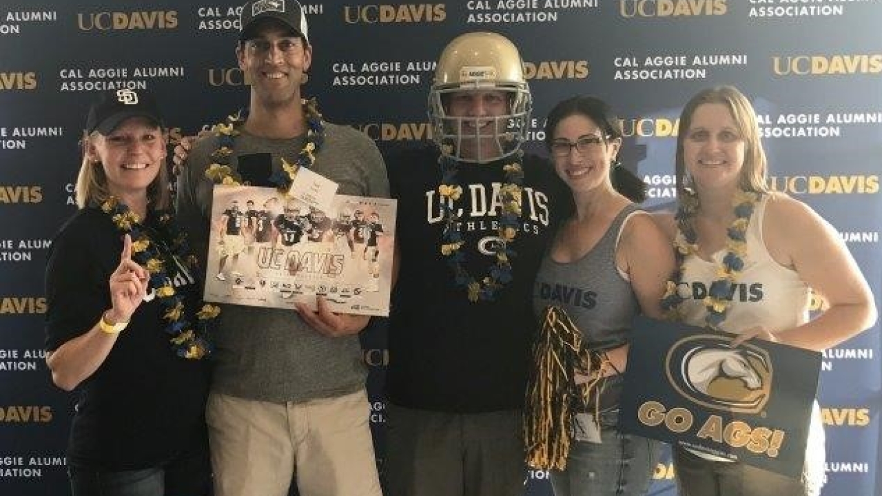 Group of alumni at a 2017 football game