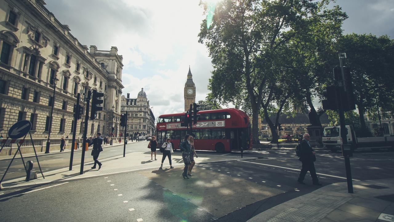 Picture of a London street of a doubledecker bus and Big Ben.