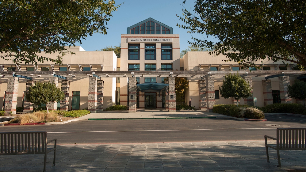 A front view of the Walter A. Buehler Alumni Center on a sunny day.