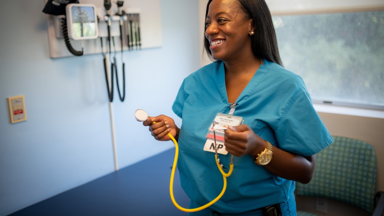 Pediatric nurse practitioner Bola Olarewaju, Ph.D. ’20 in an exam room at UC Davis Health.