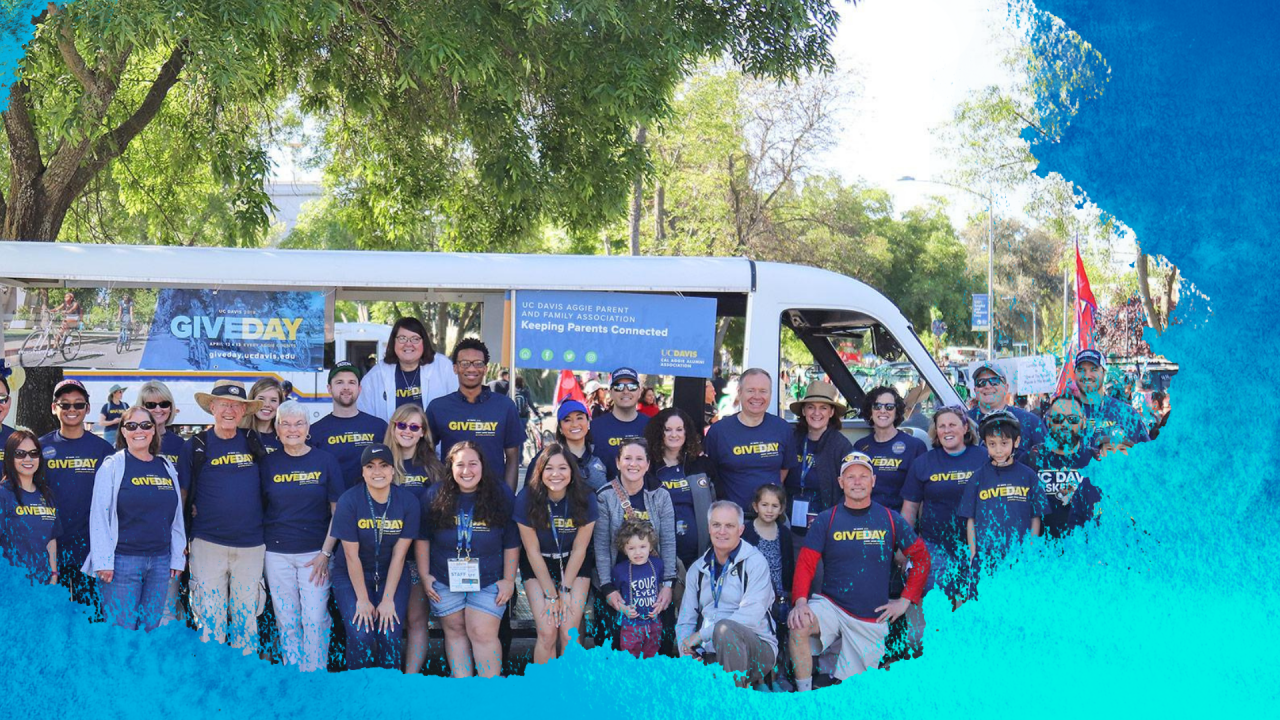 image of group in front of parade tram