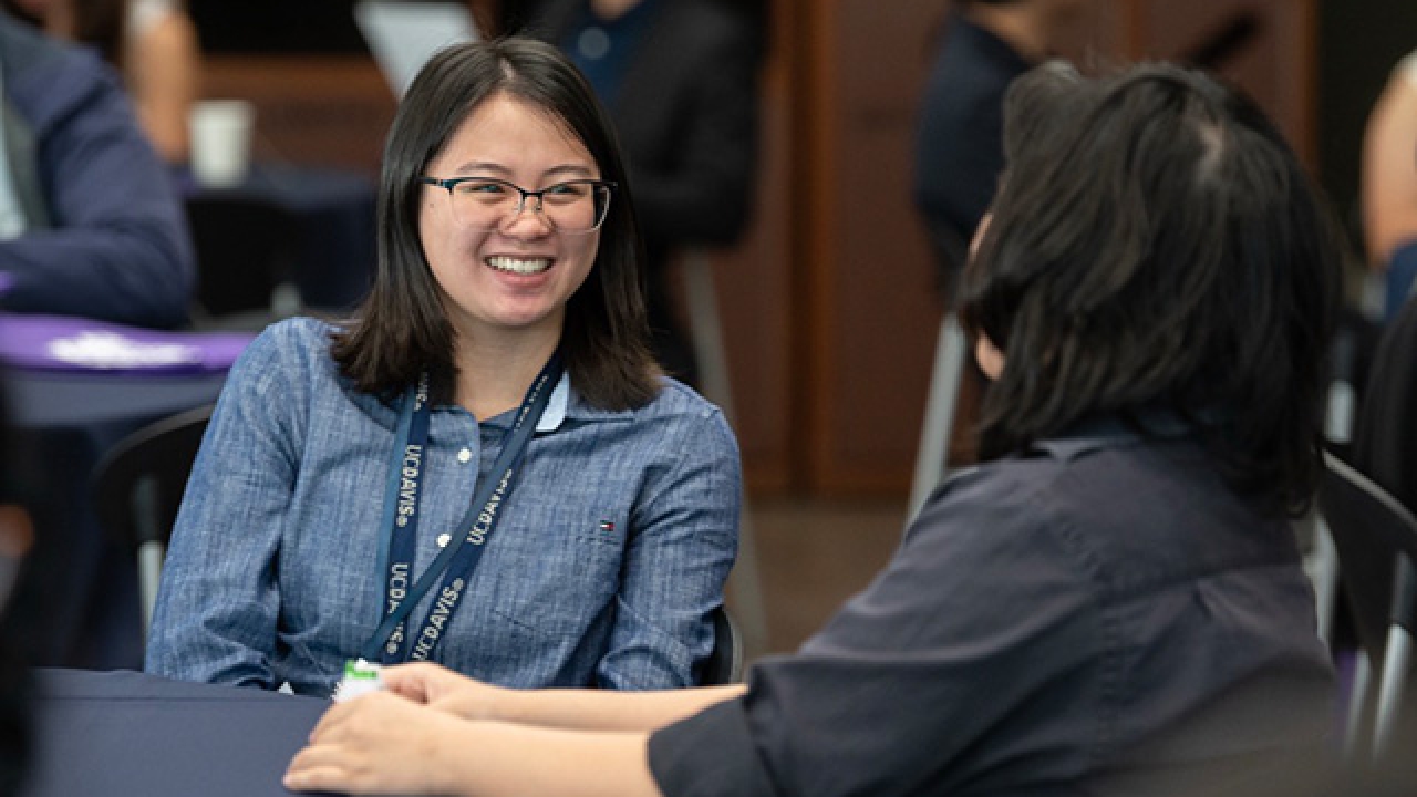 student smiling with her mentor