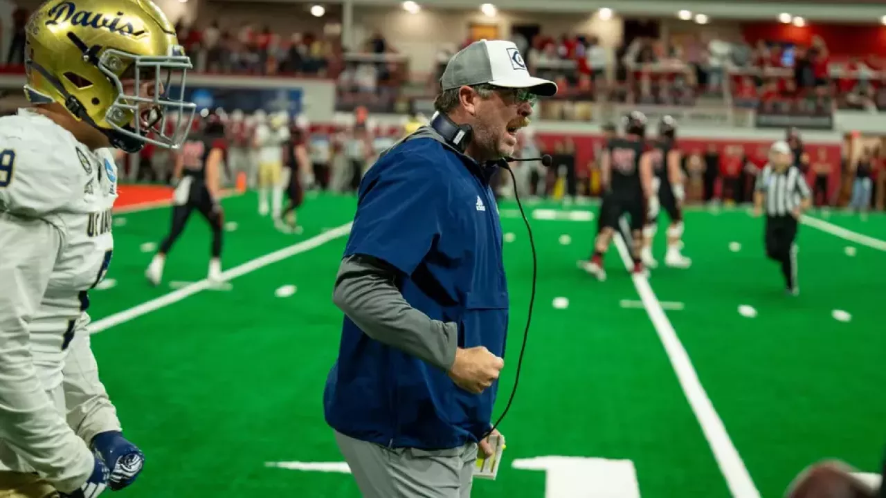 Football Coach Plough celebrating during a game