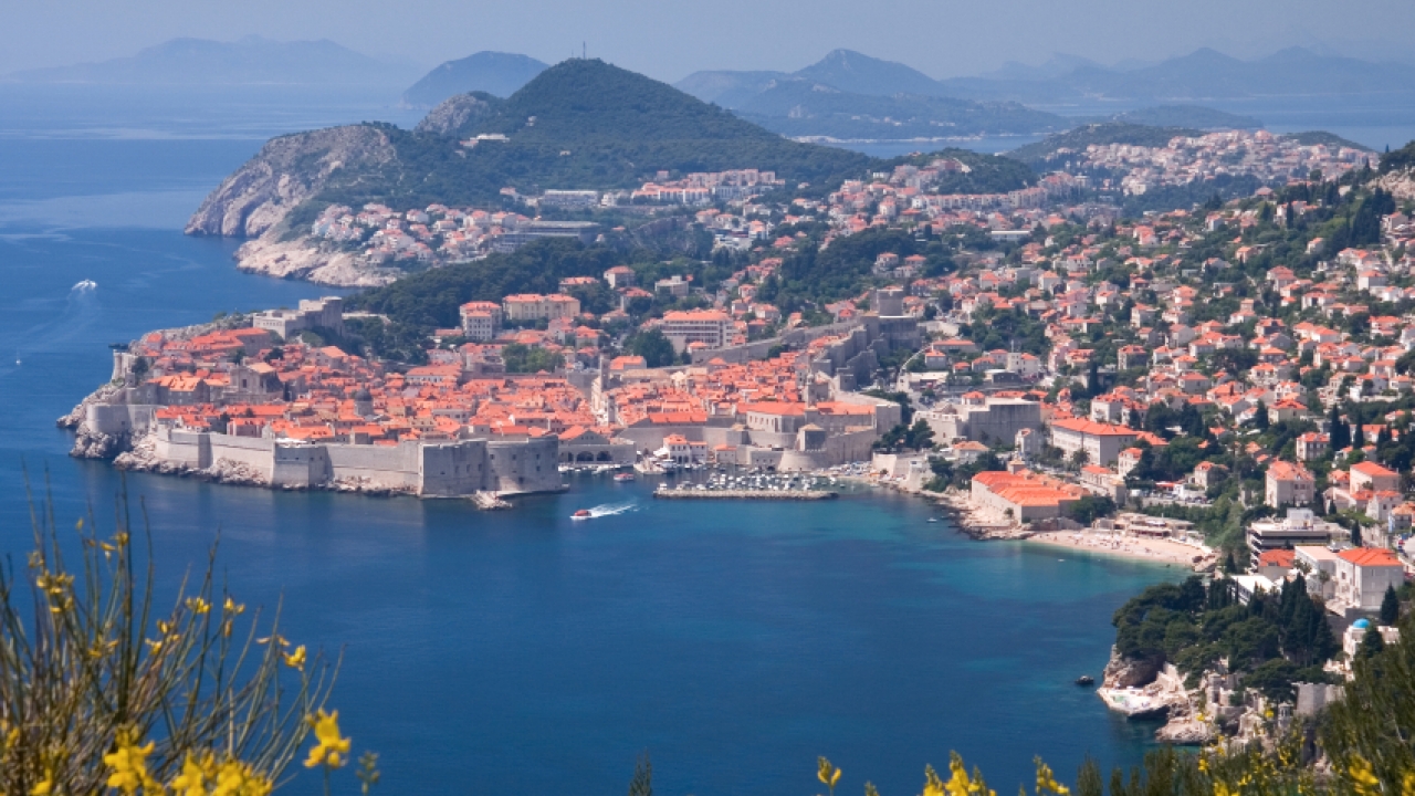 A beautiful view of the Dalmatian coastline filled with colorful buildings.