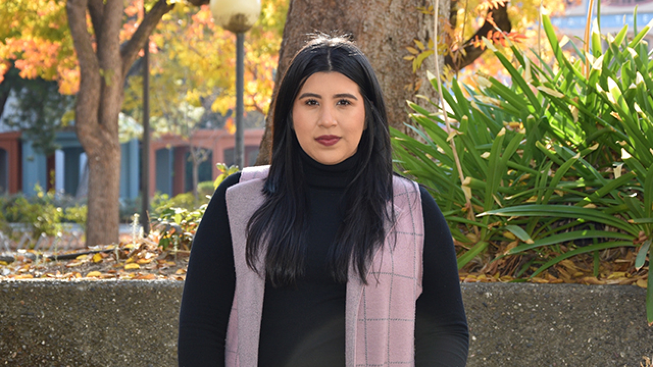 Mariel Becerra Arellano standing outdoors in the fall at UC Davis