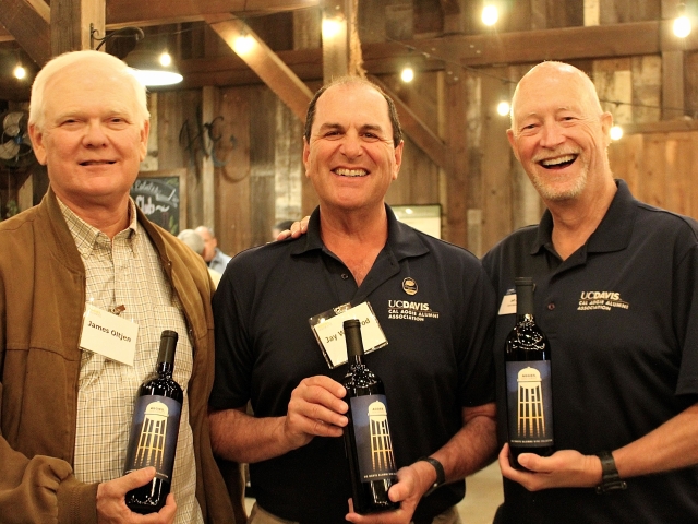 Men holding bottles of wine at the Heringer Estate 