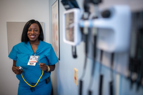 Pediatric nurse practitioner Bola Olarewaju, Ph.D. ’20 in an exam room at UC Davis Health.