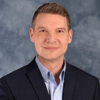 Portrait of Dennis Uhnavy