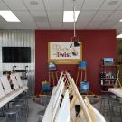 Painting with a Twist workshop with easels and paint canvases set up