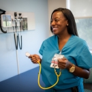 Pediatric nurse practitioner Bola Olarewaju, Ph.D. ’20 in an exam room at UC Davis Health.