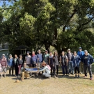 Photo of Alumni on a hike together holding a UC Davis Alumni Banner