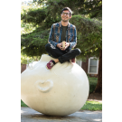 Man sitting on an egghead on the UC Davis campus 