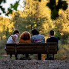 people sitting on a bench