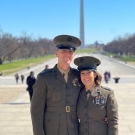 Maggie Mello and her husband posed in front of Washington Monument wearing military uniforms.