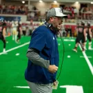 Football Coach Plough celebrating during a game