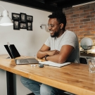 Image of man working at his laptop