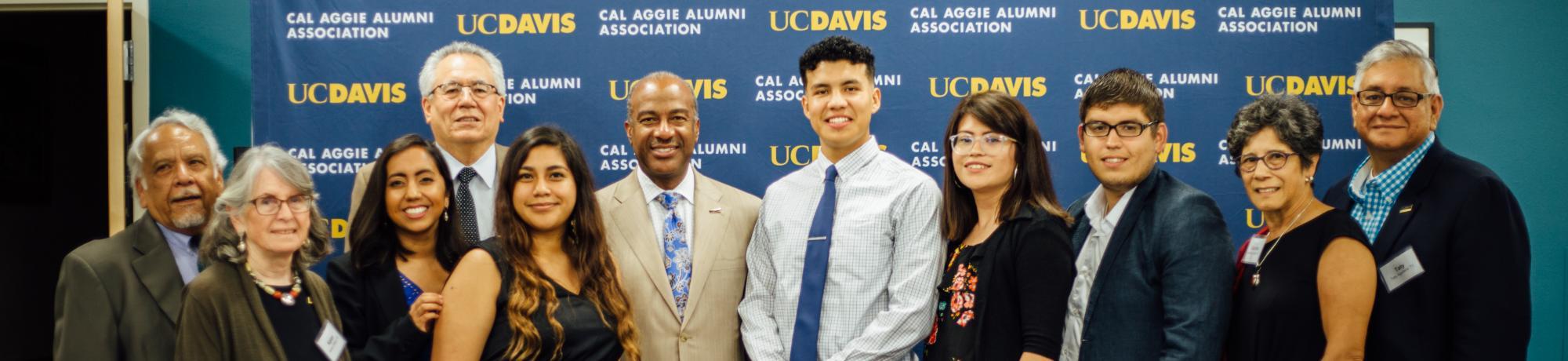 UC Davis Chicanx Latinx Alumni Association Members with UC Davis Chancellor Gary May and scholarship recipients